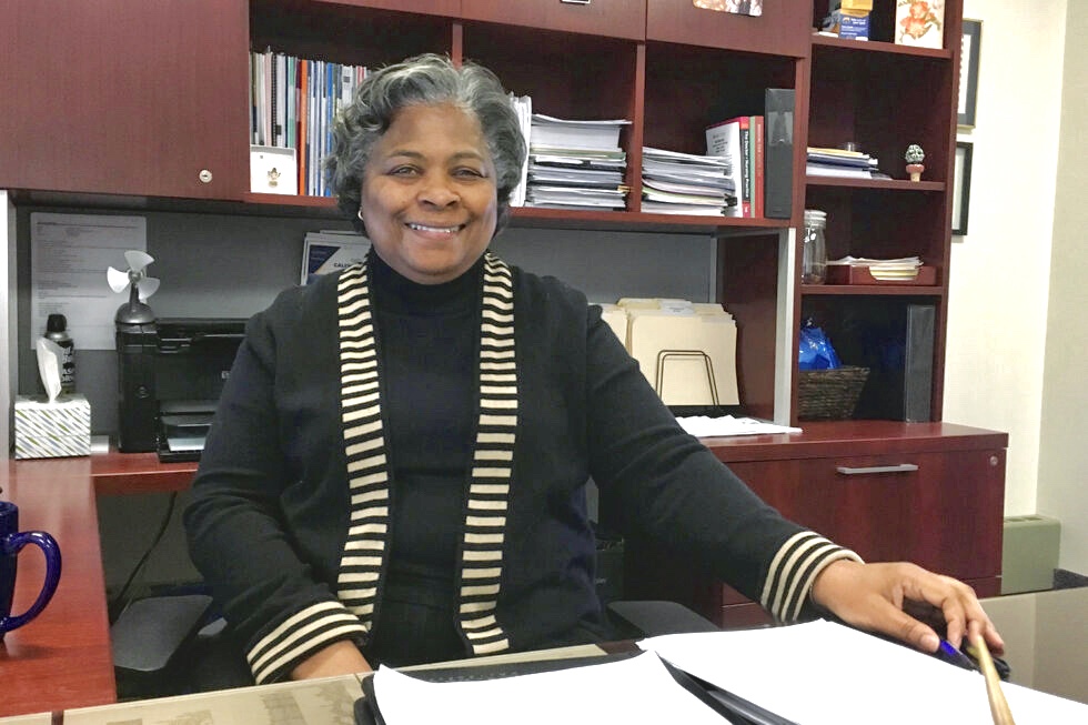 Dean Barbara Broome sits behind her desk in Henderson Hall on Kent State University's Kent campus.