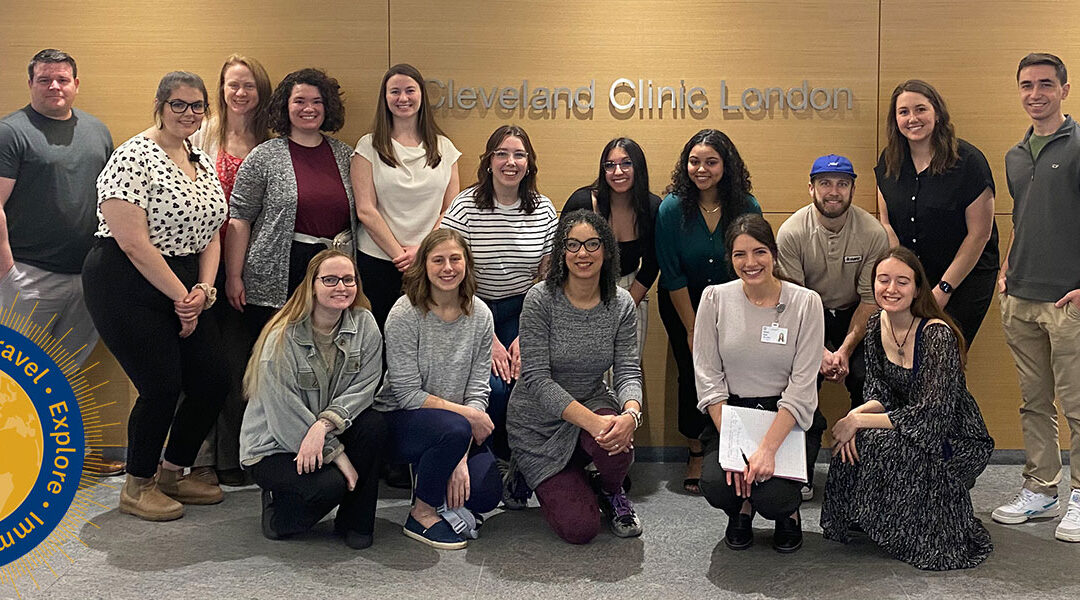Kent State nursing students pose for a group photo in front of the Cleveland Clinic London sign.