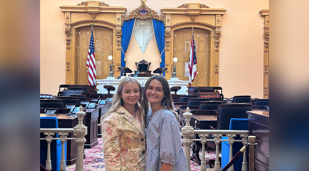 Alanna Lawson (left) and Lily Baker, pose for a photo inside the Ohio Statehouse.